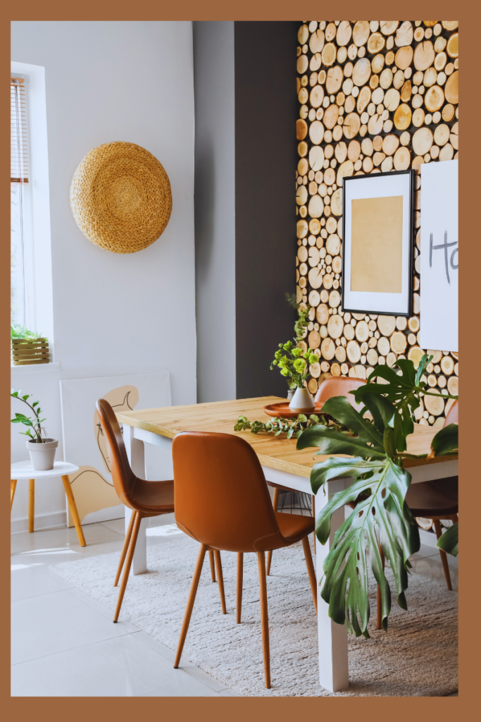 A modern dining room with a wooden table, brown leather chairs, a rustic log accent wall, and indoor plants, creating a cozy and calming home sanctuary with natural textures.