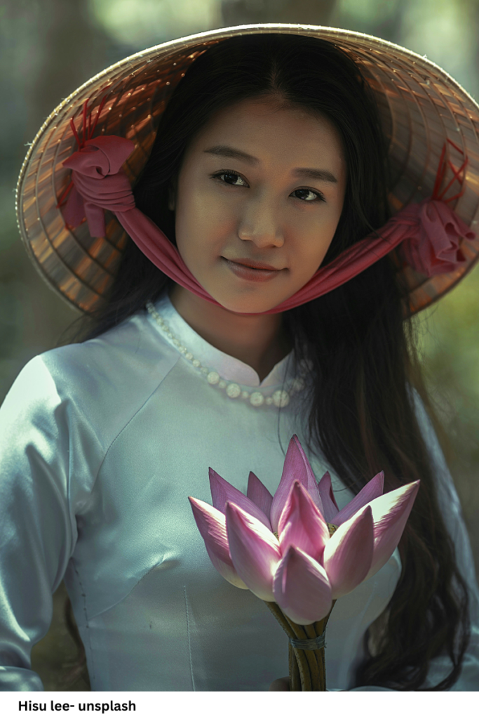 A Vietnamese woman in a traditional Vietnamese Áo Dài and Nón Lá holding a lotus flower, symbolizing grace, spirituality, and cultural tradition